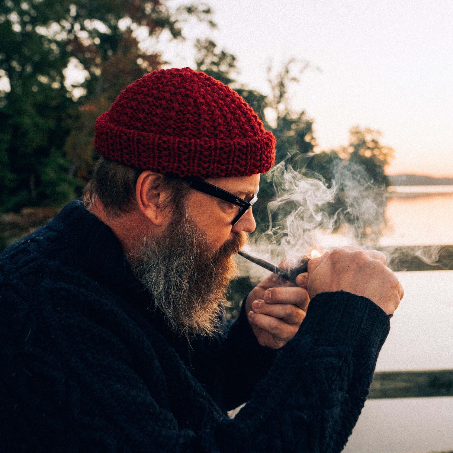 Hand knit chunky wool beanie, red, side view