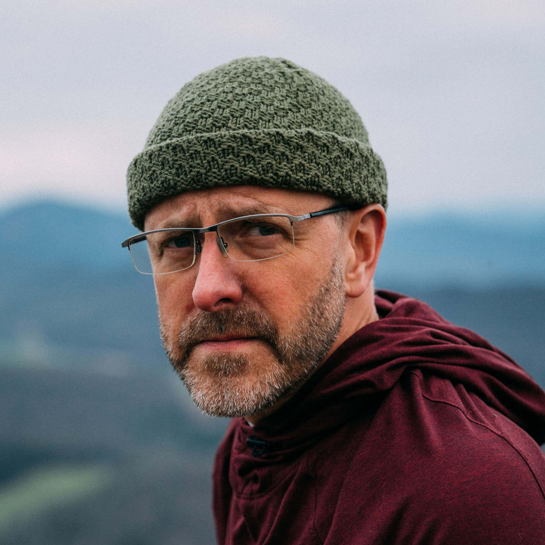 The Eastfold – hand knit merino wool beanie, olive, portrait