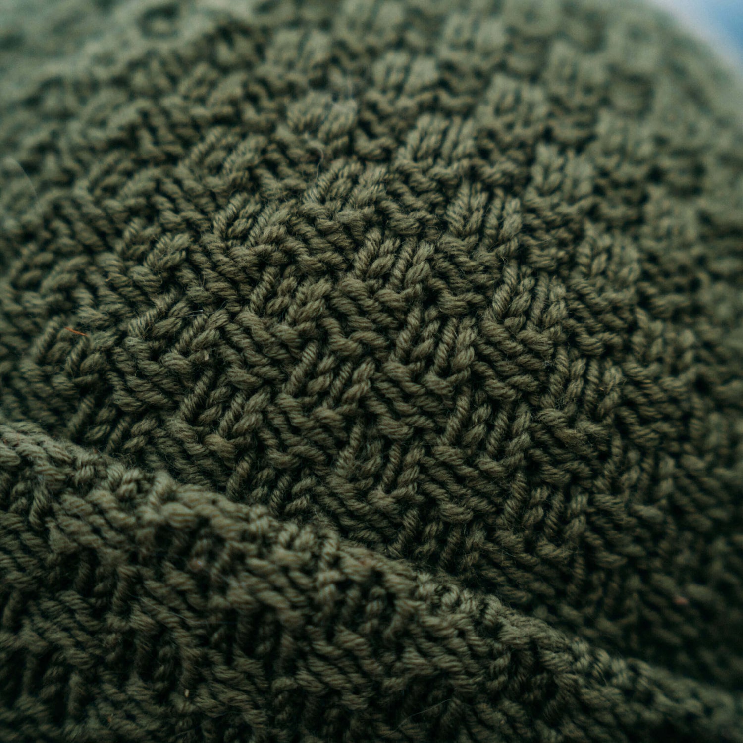 Hand knit merino wool beanie, close up pattern