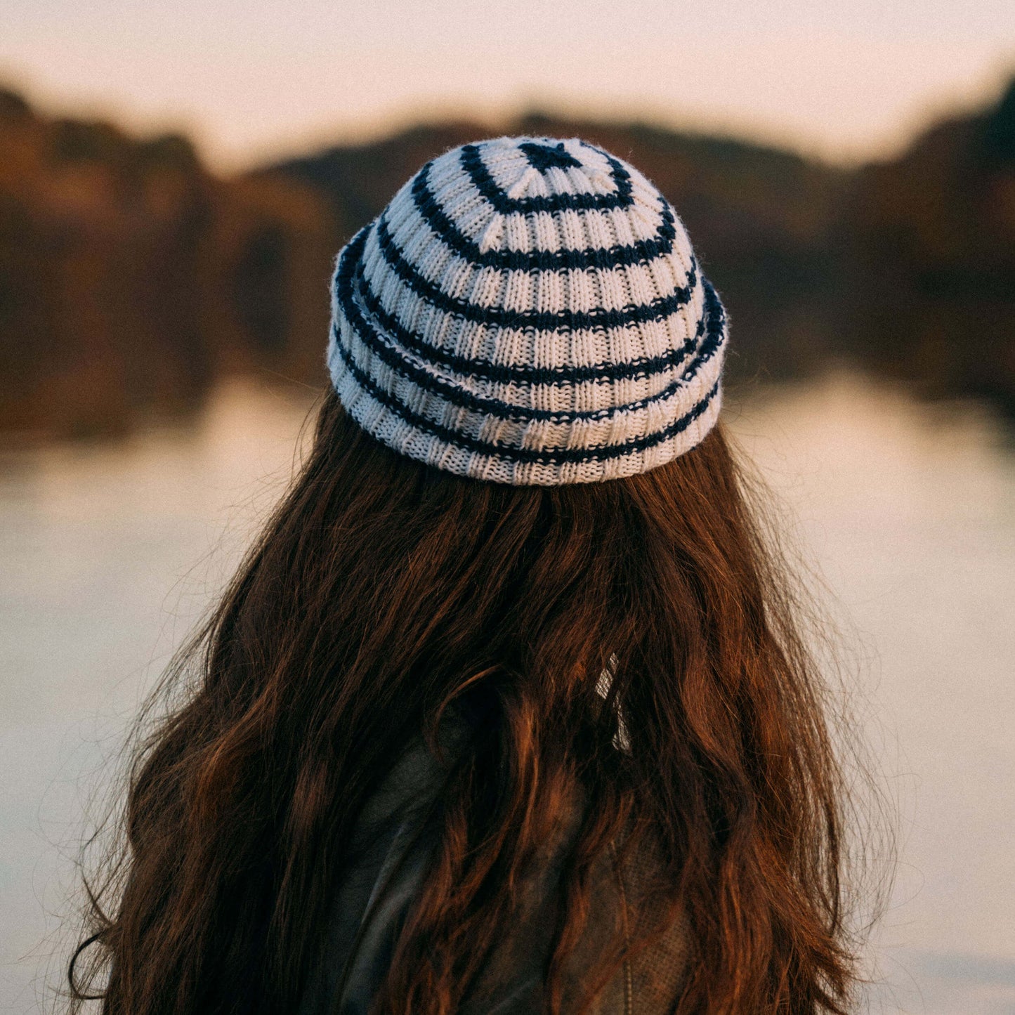 White and navy striped wool beanie, back view